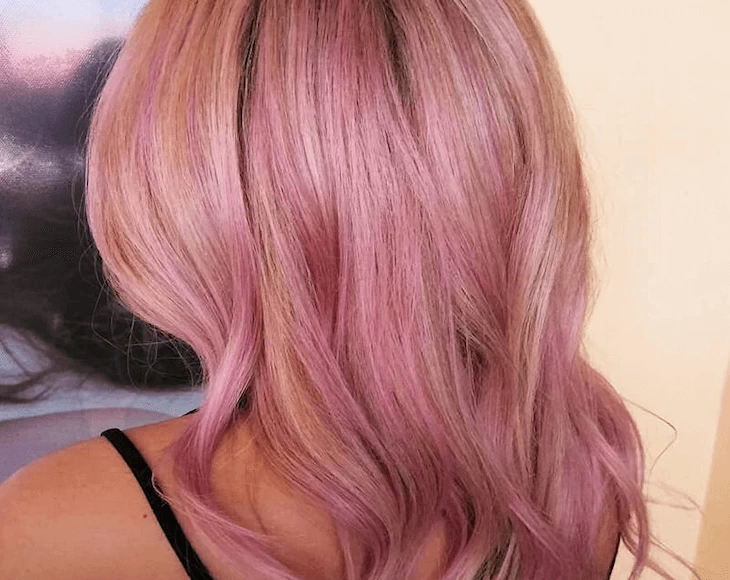 A client with pink hair coloring